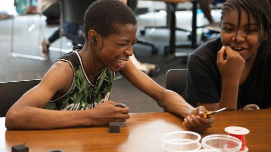 Two SONYC participants create their own working speakers.