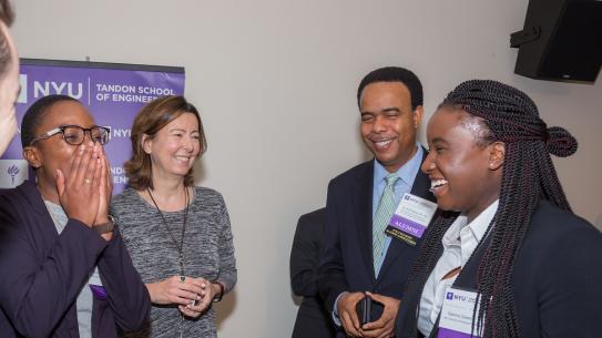 Alumni and Dean Kovačević share a laugh