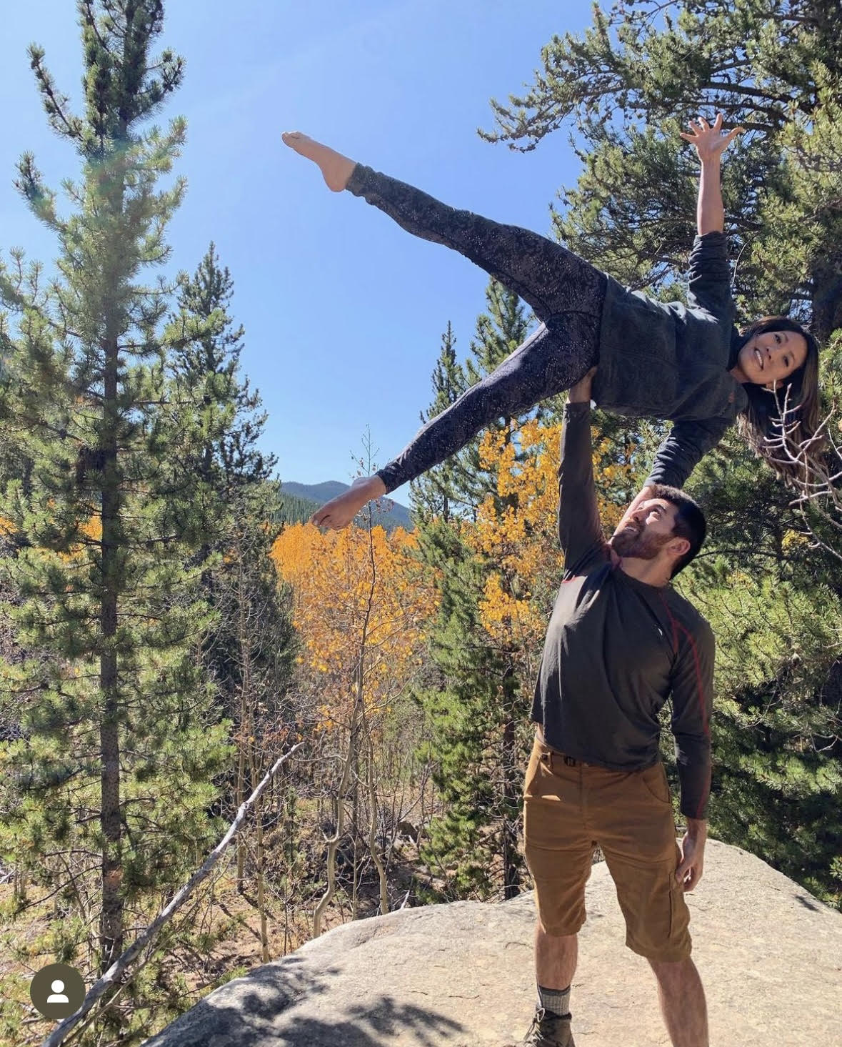 Couple Davies and Chang doing a pose of acroyoga