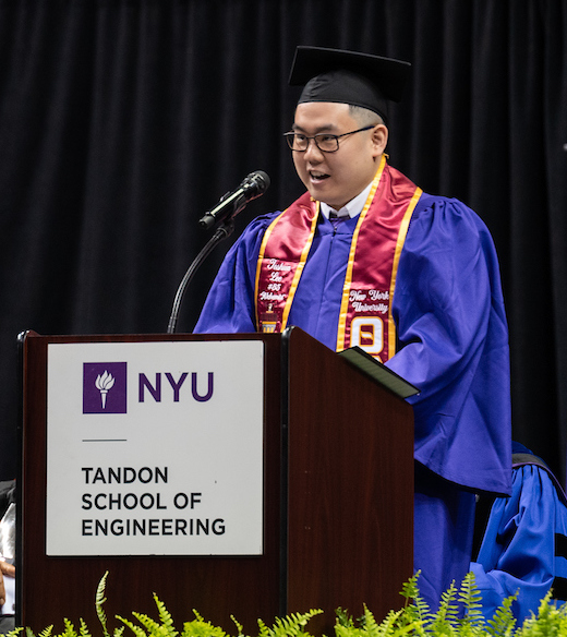 Valedictorian Joshua Lee at Podium